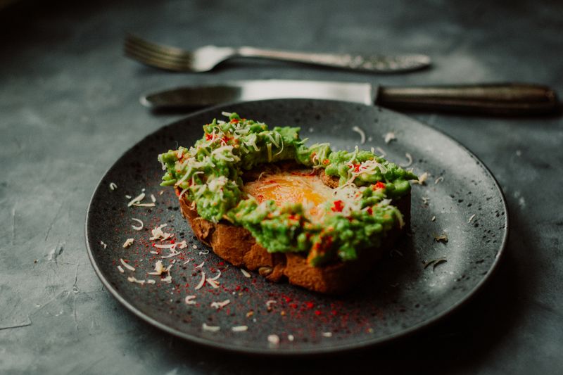 Avocado toast with poached egg and microgreens